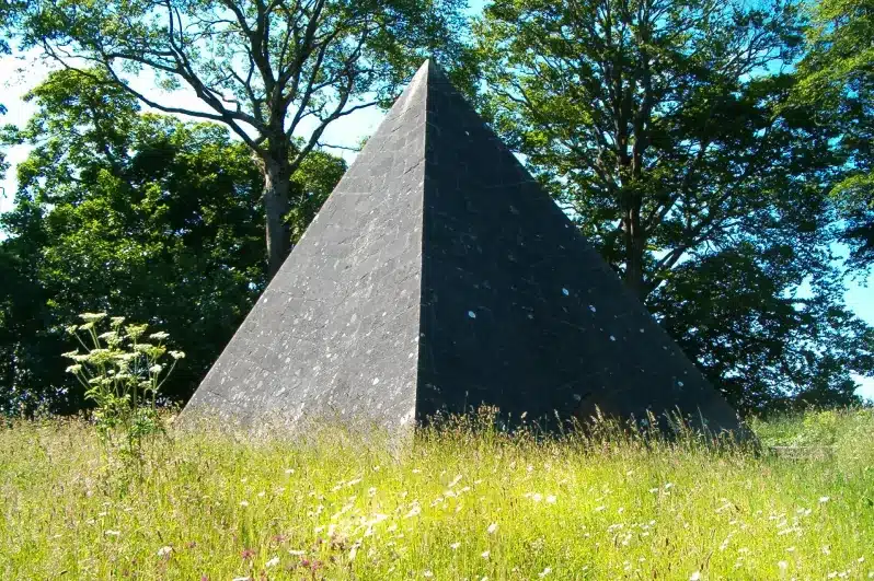 A majestic pyramid-shaped structure surrounded